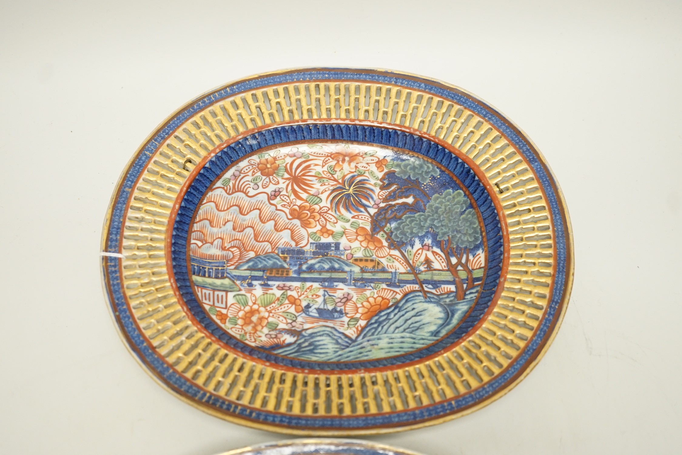 A pair of late 18th century Chinese chestnut basket stands with Dutch over enamelled decoration, 27.5cm